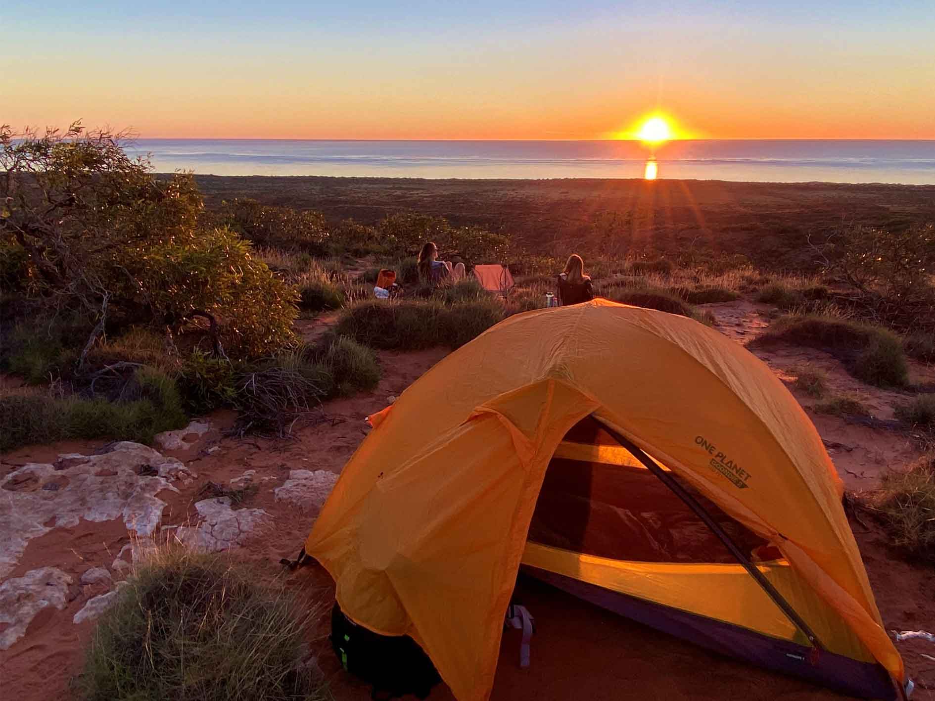 Tent on top of Cape Range, overlooking Ningaloo Reef as the sun sets